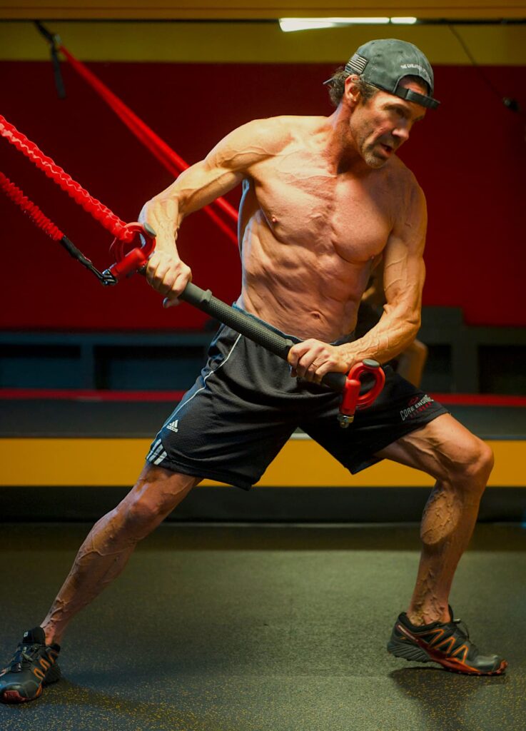 Bill Nurge Functional Training his core with resistance bands at Hardcore Training Center, in Ketchum, Idaho using the Catalyzer portable gym.